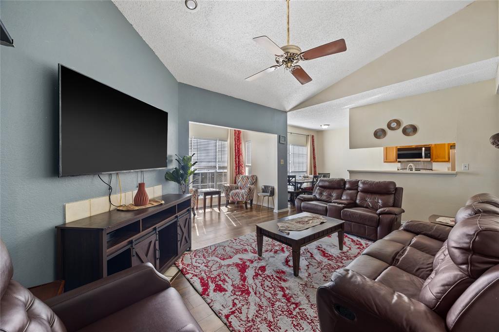 4115 Esters Road, Unit 710 Irving, TX 75038 - Photo 2 of 14 a living room with furniture and a flat screen tv