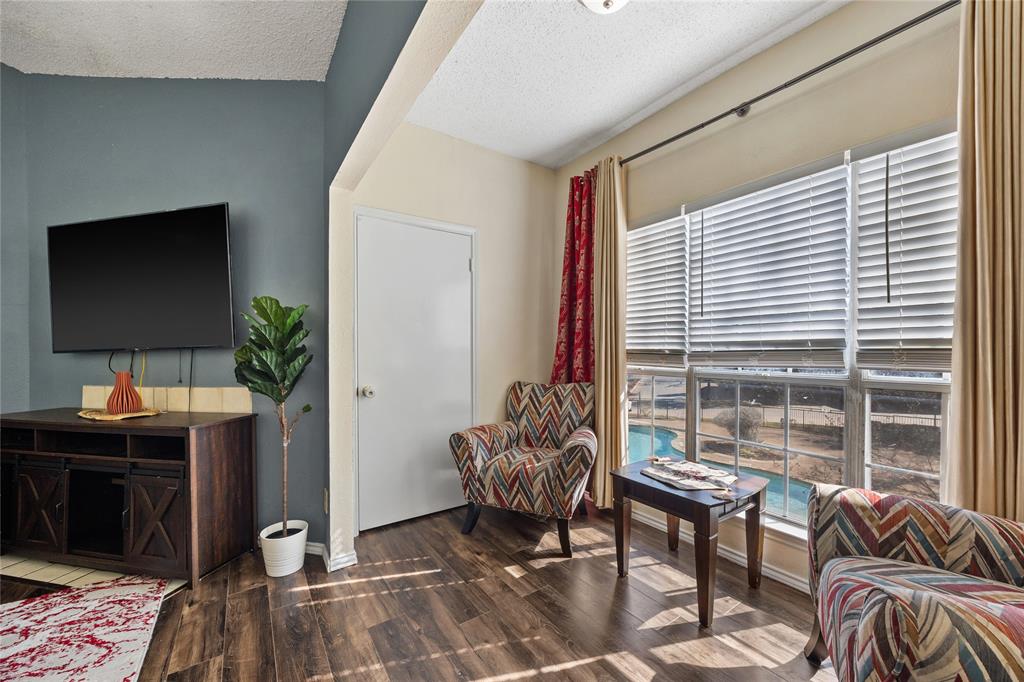 4115 Esters Road, Unit 710 Irving, TX 75038 - Photo 4 of 14 a living room with furniture and a window