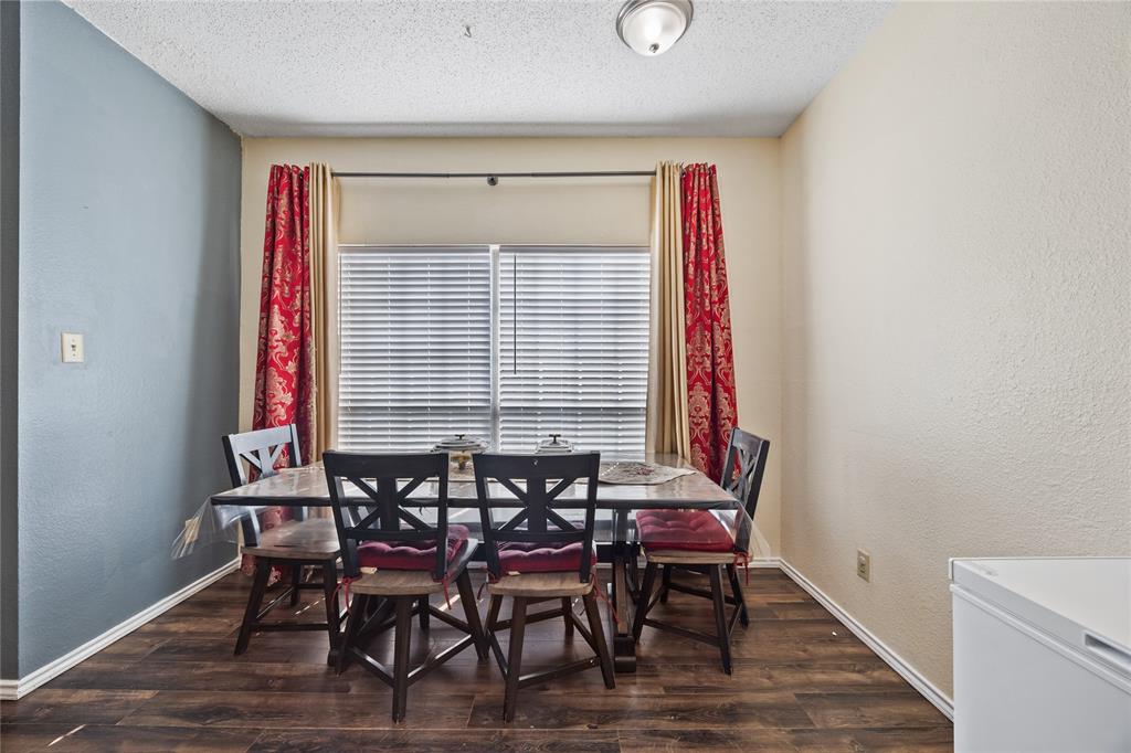 4115 Esters Road, Unit 710 Irving, TX 75038 - Photo 6 of 14 a view of a dining room with furniture and wooden floor