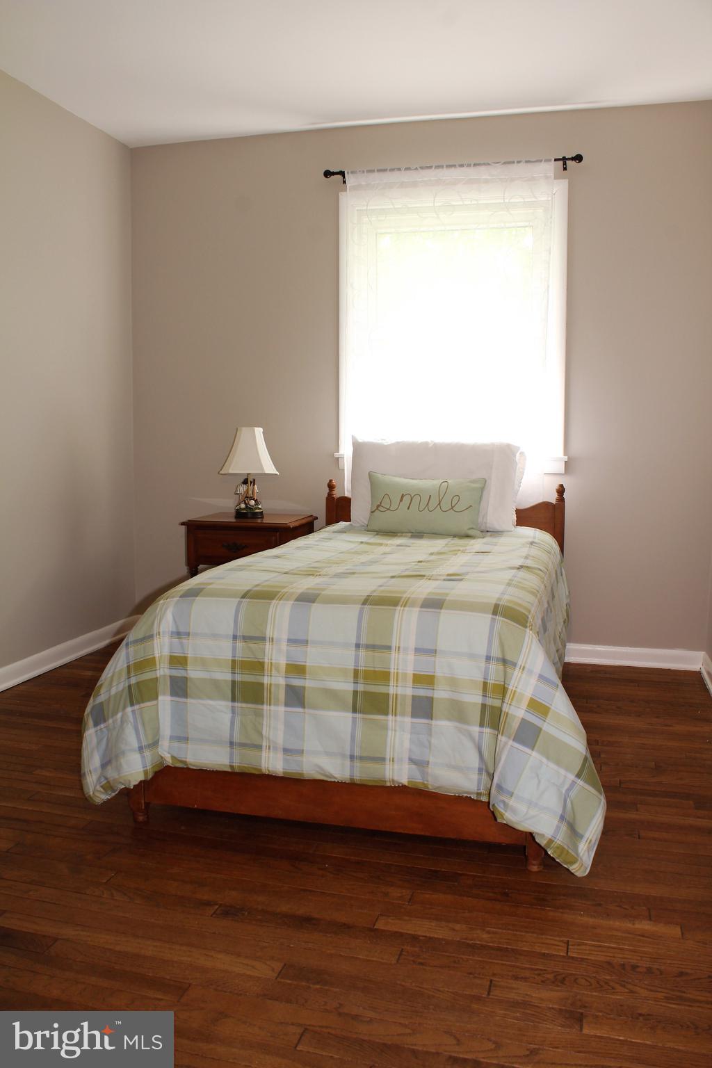 1713 Abelia Road Fallston, MD 21047 - Photo 22 of 40 Bedroom #3 fresh paint and the wood floors contine