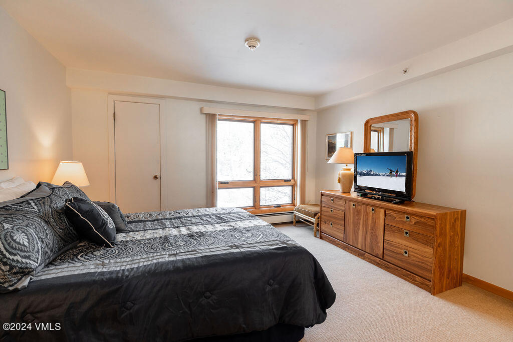 993 Lions Ridge Loop, Unit 343 Vail, CO 81657 - Photo 6 of 15 a bedroom with a bed and a television