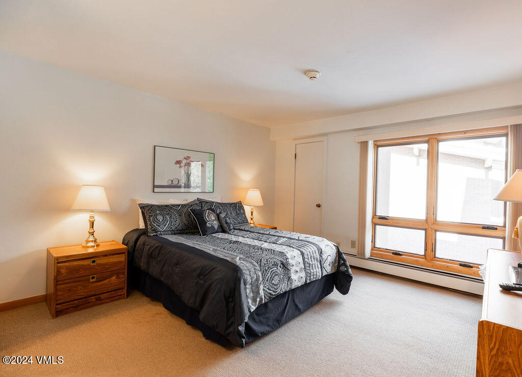 993 Lions Ridge Loop, Unit 343 Vail, CO 81657 - Photo 7 of 15 a bedroom with a bed and a large window