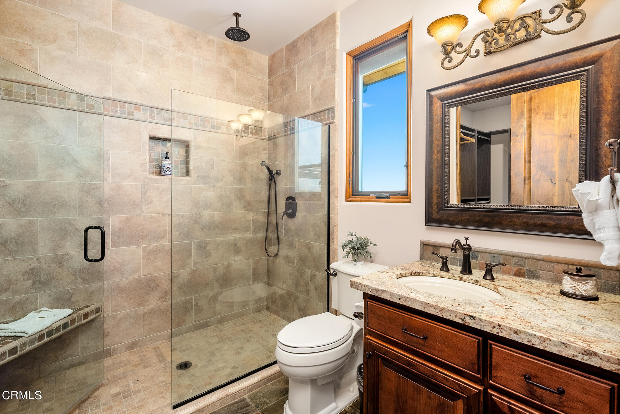 6060 Jardine Road Paso Robles, CA 93446 - Photo 29 of 74 a bathroom with a granite countertop toilet sink and shower