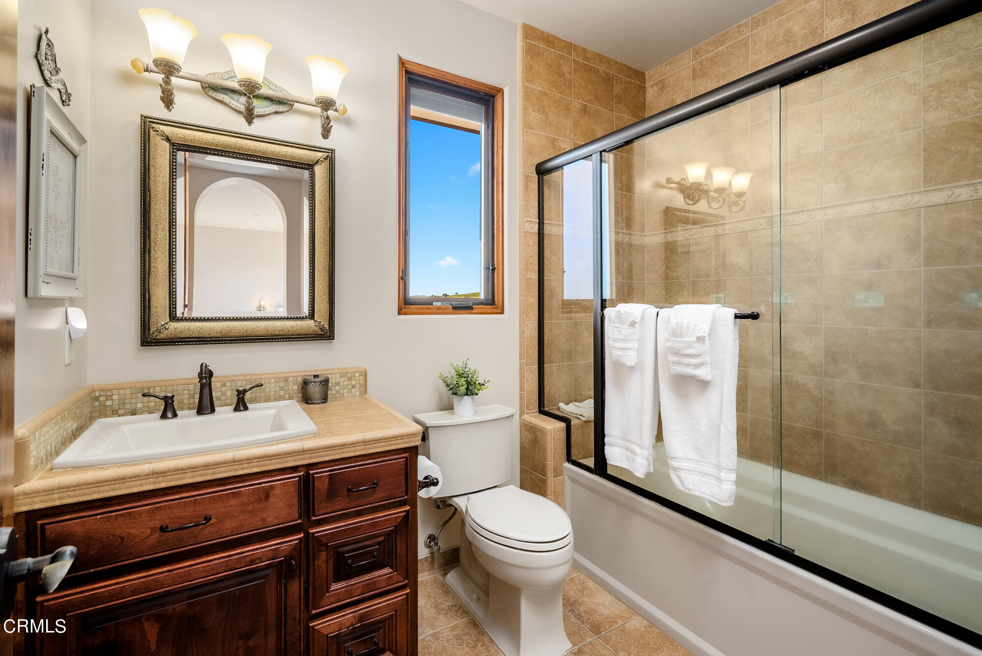 6060 Jardine Road Paso Robles, CA 93446 - Photo 32 of 74 a bathroom with a toilet a sink and glass door