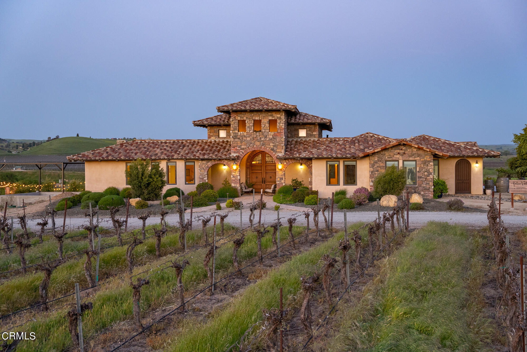 6060 Jardine Road Paso Robles, CA 93446 - Photo 4 of 74 a view of a house with a yard and table and chairs under an umbrella