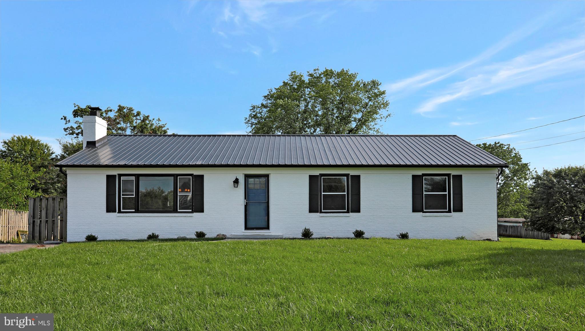 3192 Old Leetown Pike Ranson, WV 25438 - Photo 1 of 50 a house view with a garden space