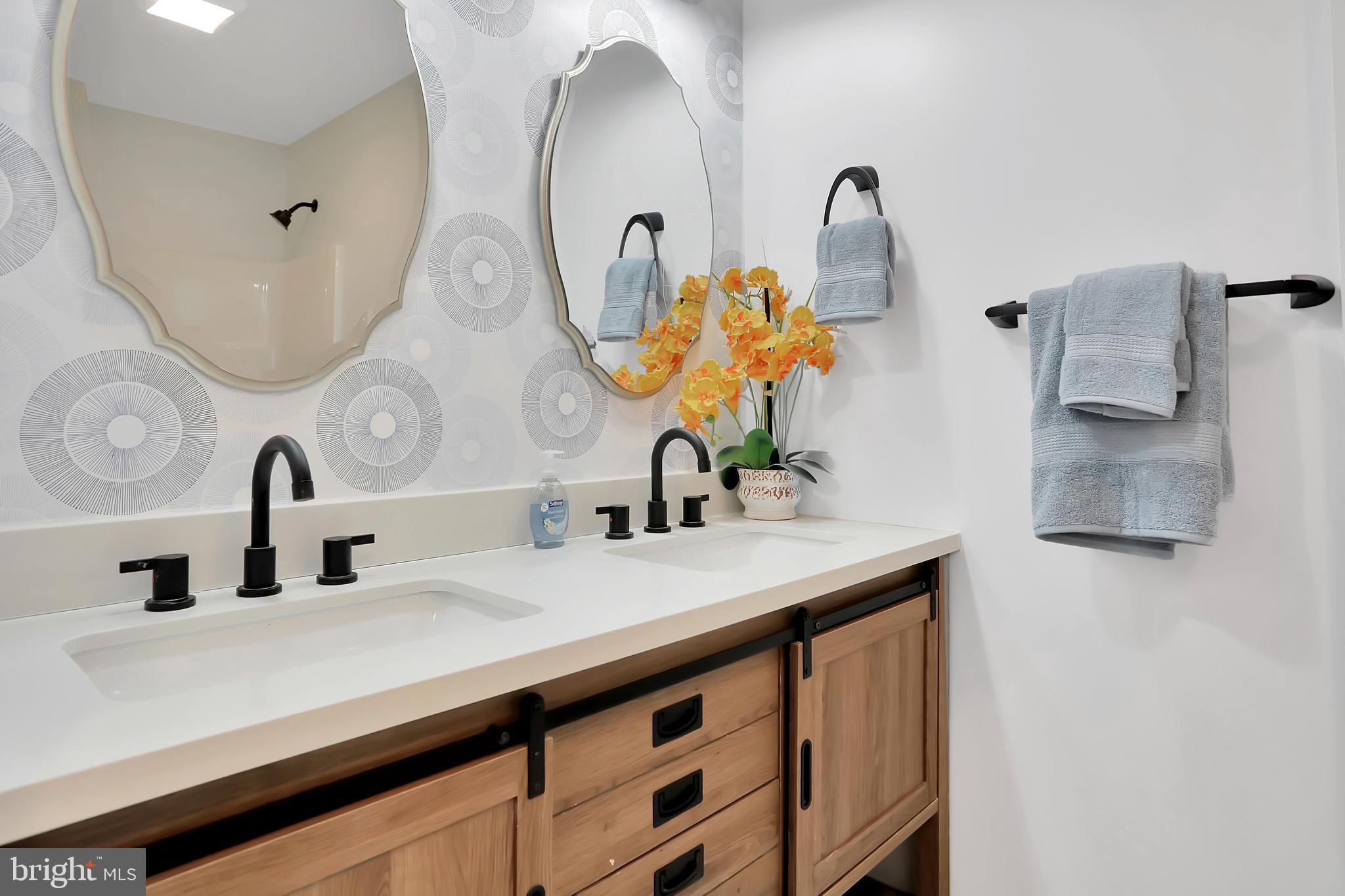 3192 Old Leetown Pike Ranson, WV 25438 - Photo 25 of 50 a bathroom with double vanity sinks and a mirror