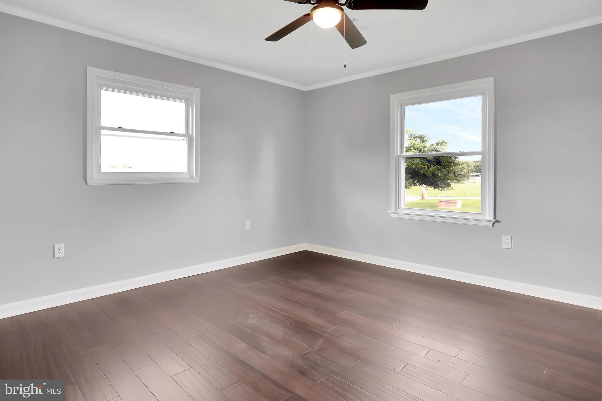 3192 Old Leetown Pike Ranson, WV 25438 - Photo 28 of 50 a view of an empty room with wooden floor and a window