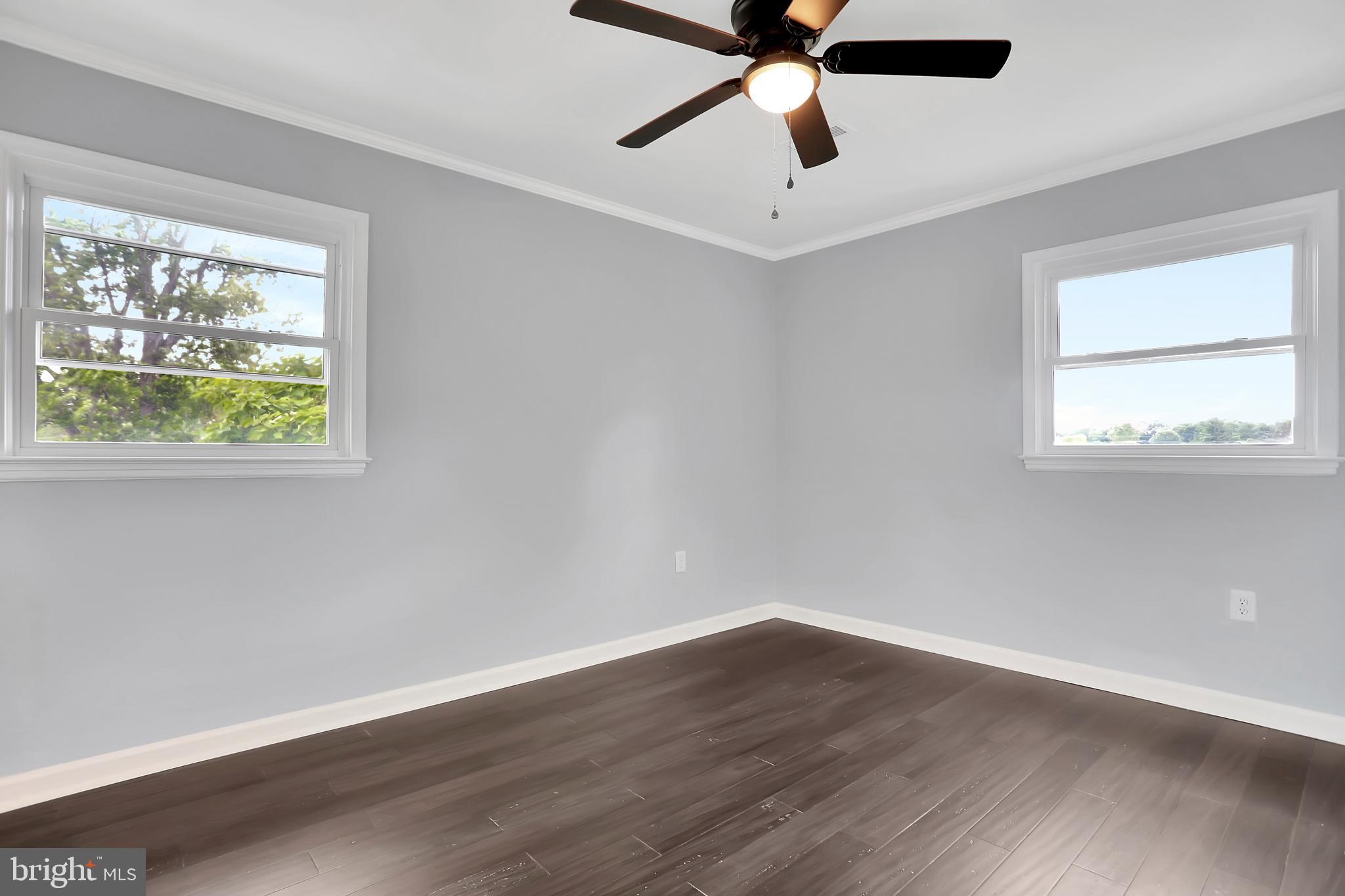 3192 Old Leetown Pike Ranson, WV 25438 - Photo 30 of 50 a view of an empty room with wooden floor and a window
