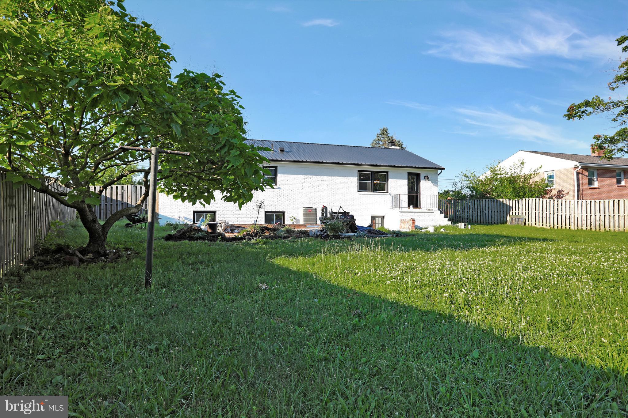 3192 Old Leetown Pike Ranson, WV 25438 - Photo 49 of 50 a view of a house with a big yard potted plants and large tree
