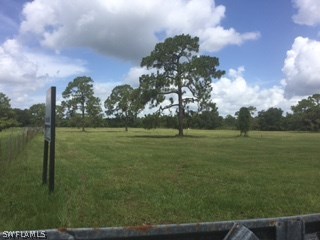 19191 Parkinson Road Alva, FL 33920 - Photo 1 of 5 a view of a golf course with a lake