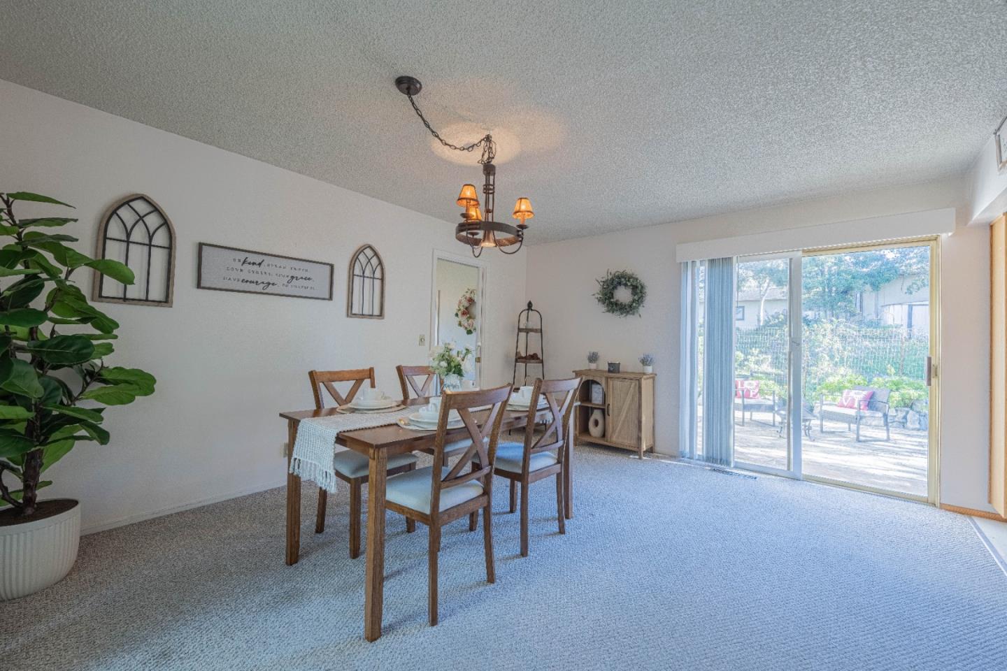 9525 South Century Oak Road Salinas, CA 93907 - Photo 11 of 37 a view of a dining room with furniture and a potted plant