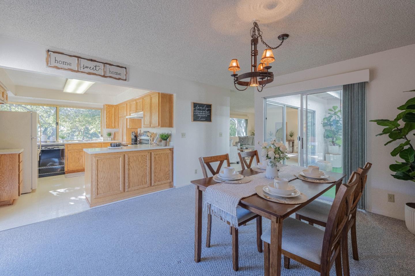 9525 South Century Oak Road Salinas, CA 93907 - Photo 15 of 37 a view of a dining room and livingroom with furniture wooden floor a chandelier