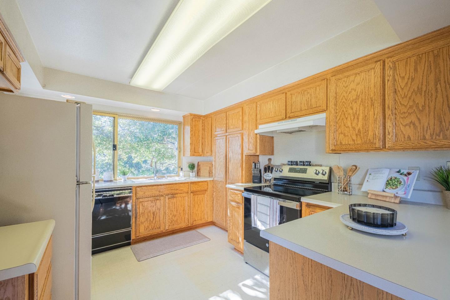 9525 South Century Oak Road Salinas, CA 93907 - Photo 17 of 37 a kitchen with stainless steel appliances a stove a sink a cabinets and a refrigerator
