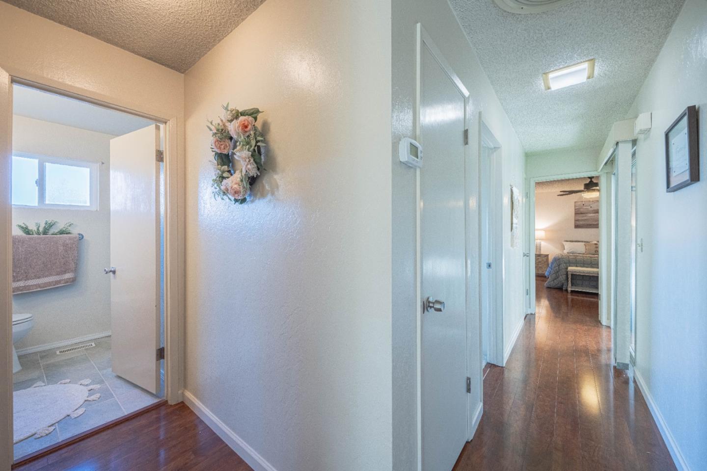 9525 South Century Oak Road Salinas, CA 93907 - Photo 23 of 37 a view of a hallway with wooden floor