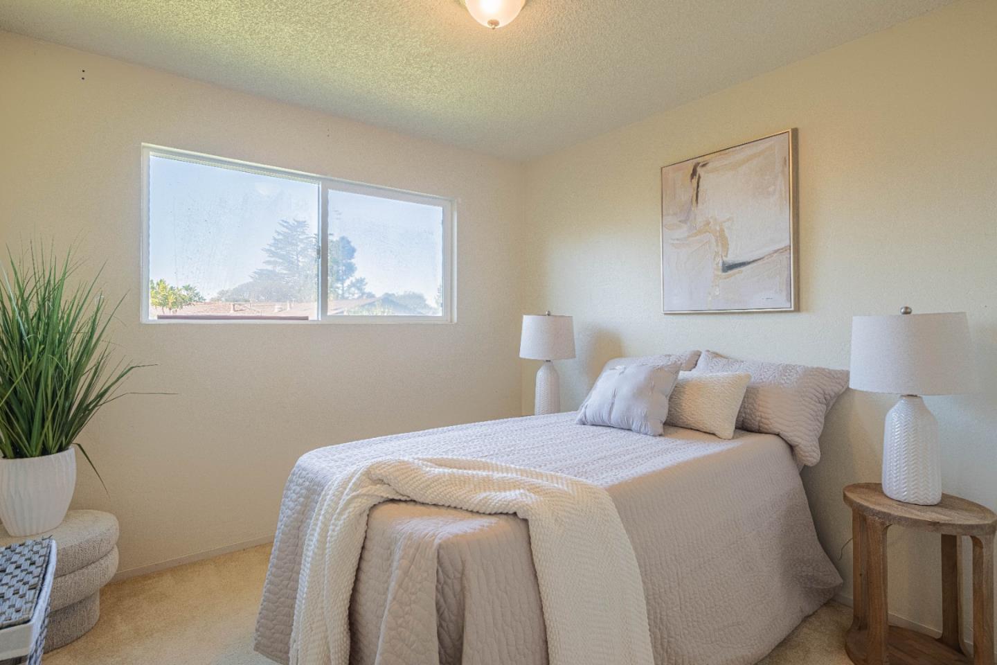 9525 South Century Oak Road Salinas, CA 93907 - Photo 29 of 37 a bedroom with a bed and a potted plant