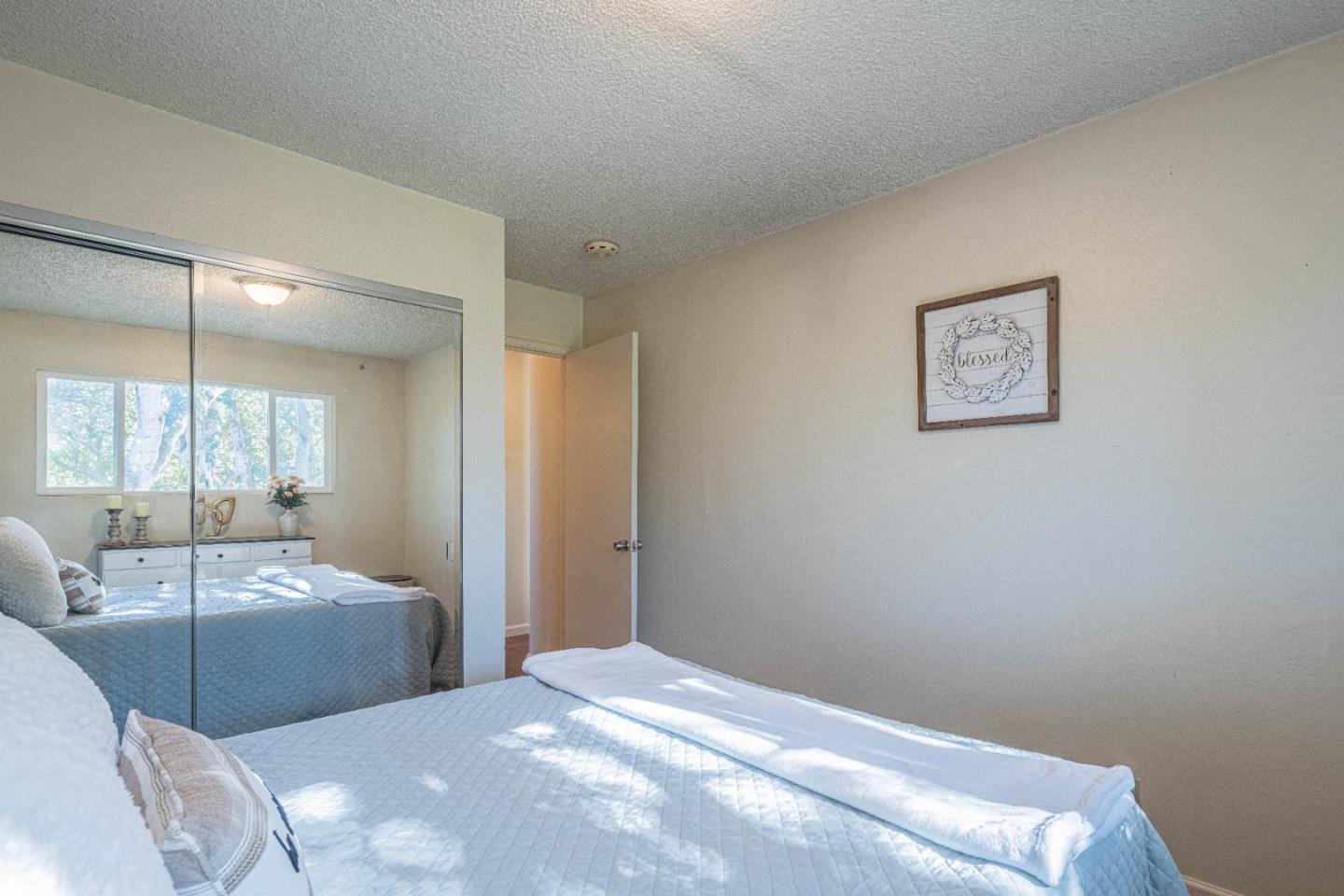 9525 South Century Oak Road Salinas, CA 93907 - Photo 32 of 37 a bedroom with a bed and a couch