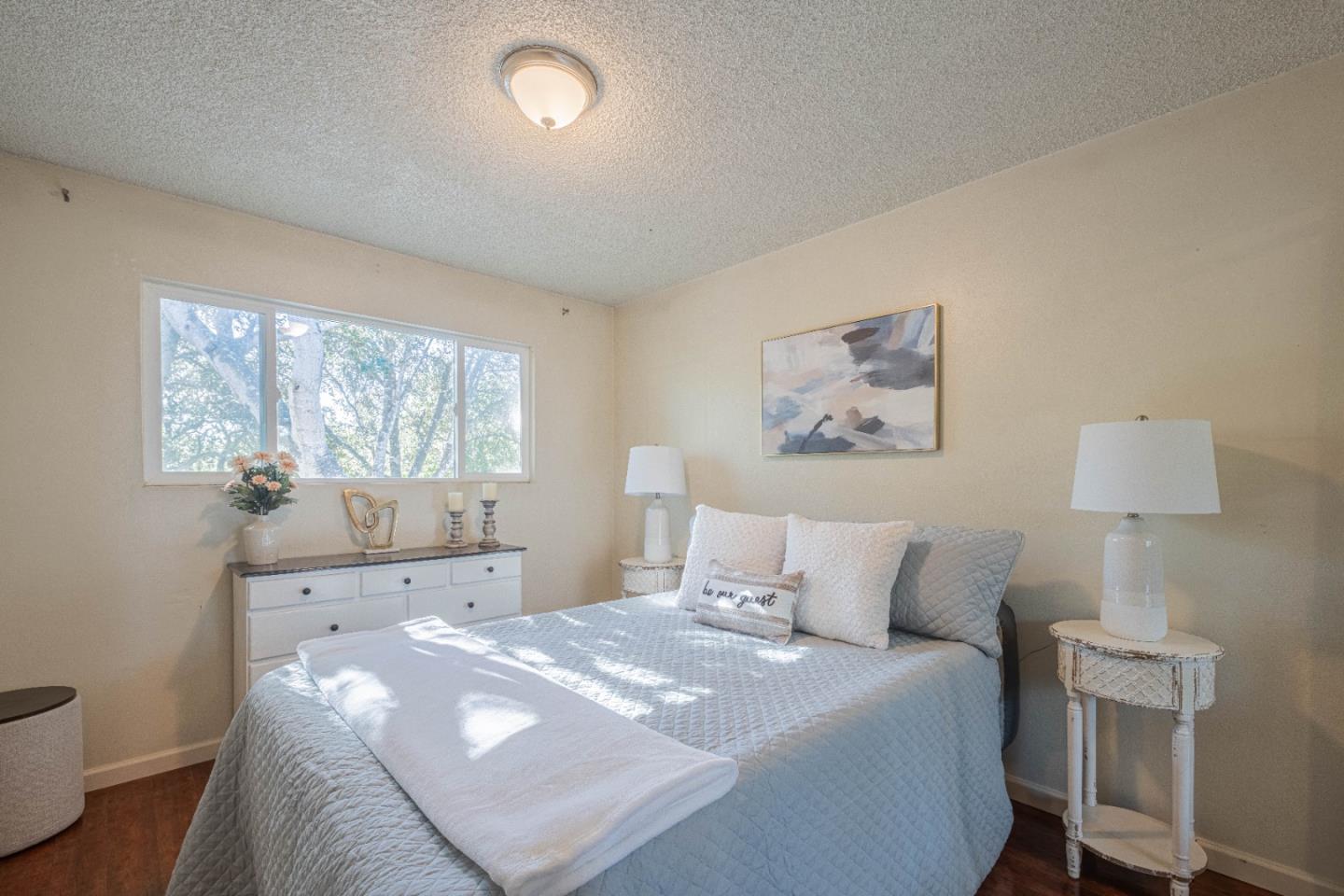 9525 South Century Oak Road Salinas, CA 93907 - Photo 33 of 37 a bedroom with a bed and a lamp with window