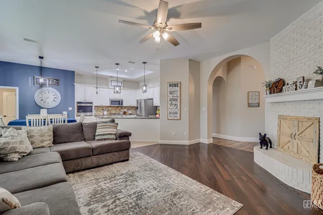a living room with furniture and kitchen view