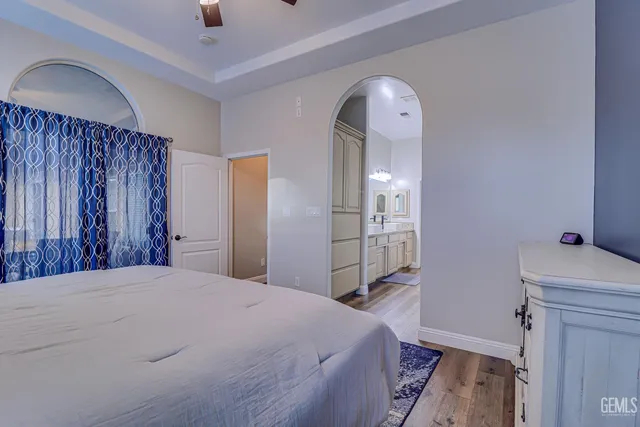 a bedroom with a bed and a dresser