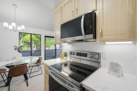 a kitchen with a stove and a microwave