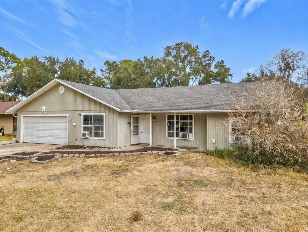 2509 Juniper Drive Edgewater, FL 32141 - Photo 1 of 1 a front view of a house with yard