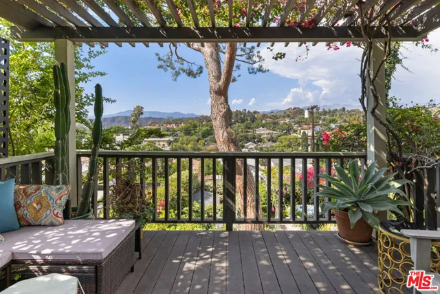 a view of a balcony with wooden floor