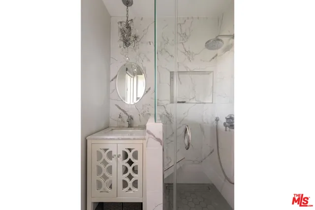 a bathroom with a bathtub and shower