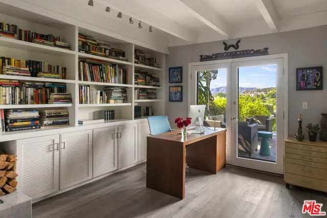 a room with cabinets and book shelf