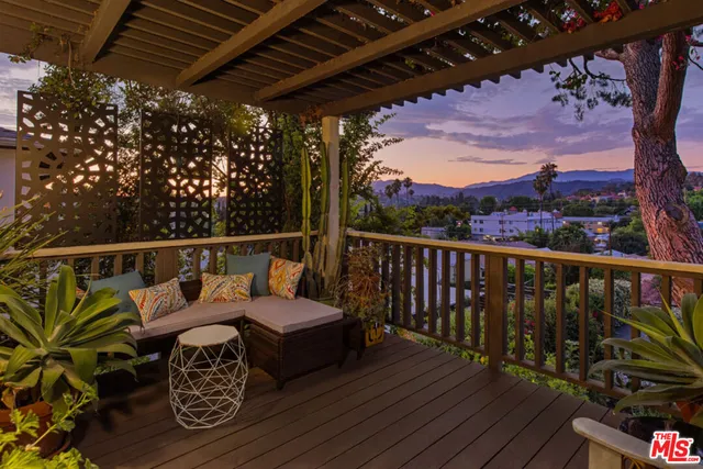 a view of a balcony with wooden floor
