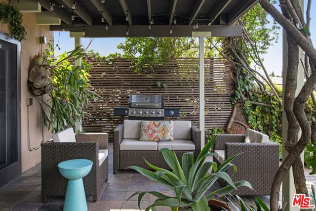 a view of a chairs and table in a patio