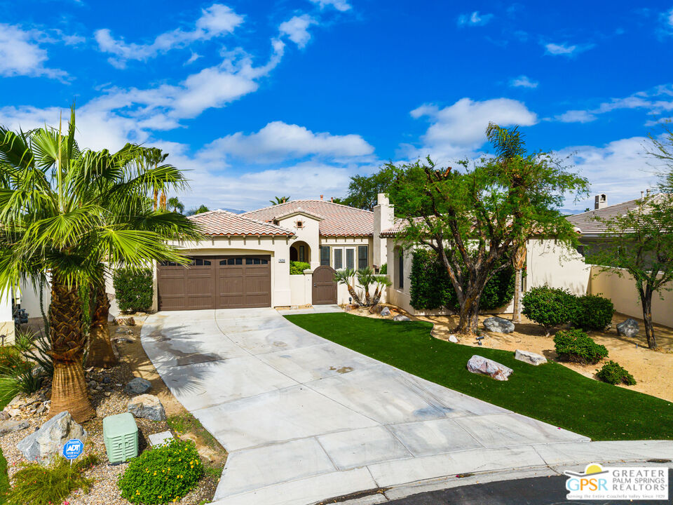 74226 Via Venezia Palm Desert, CA 92260 - Photo 1 of 38 a view of a white house with a yard