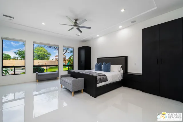 a bed room with a bed and a large window