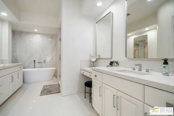 a bathroom with a bathtub and a sink