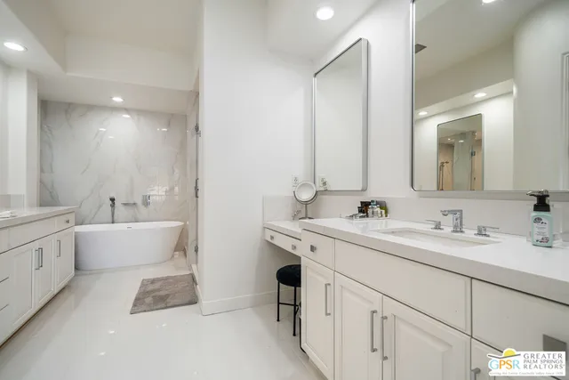 a bathroom with a bathtub and a sink