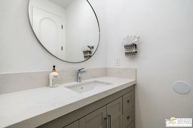 a view of a dining room with furniture a livingroom and wooden floor