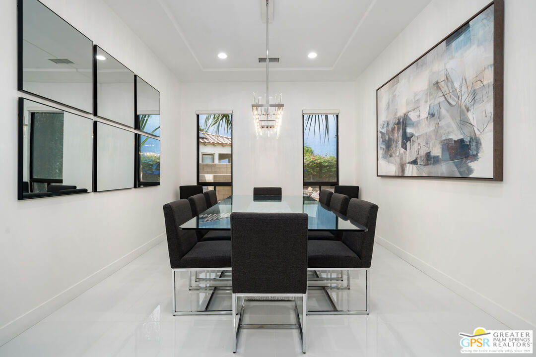 74226 Via Venezia Palm Desert, CA 92260 - Photo 30 of 38 a view of a dining room with furniture window and wooden floor