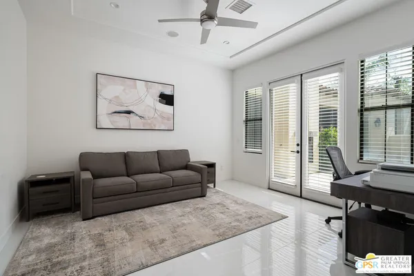 a view of a bedroom with furniture
