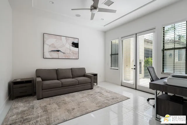 a view of a bedroom with furniture