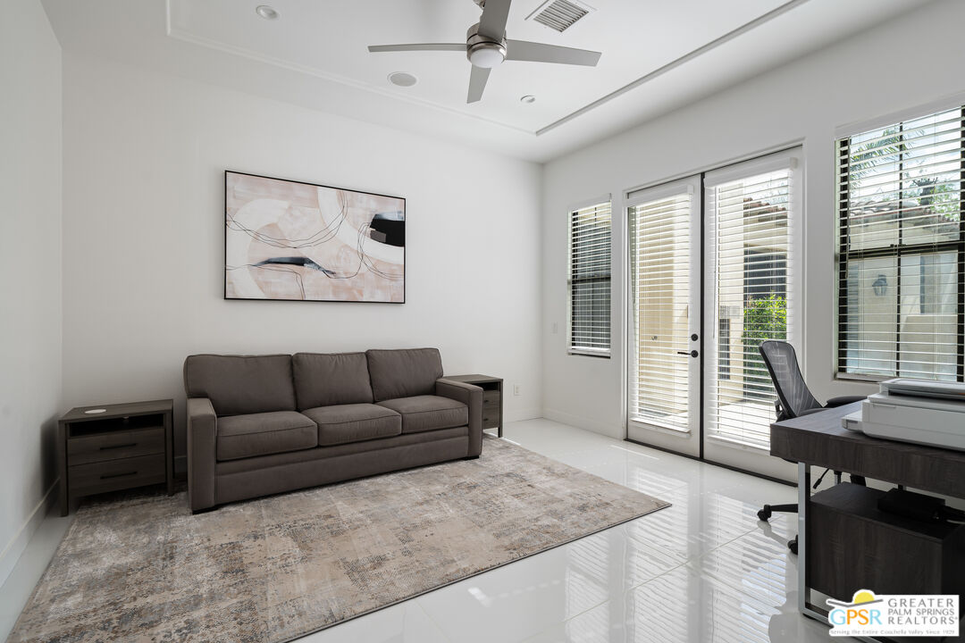 74226 Via Venezia Palm Desert, CA 92260 - Photo 31 of 38 a living room with furniture and a window