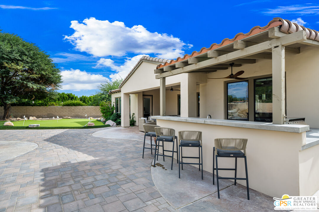 74226 Via Venezia Palm Desert, CA 92260 - Photo 34 of 38 a view of a house with a porch