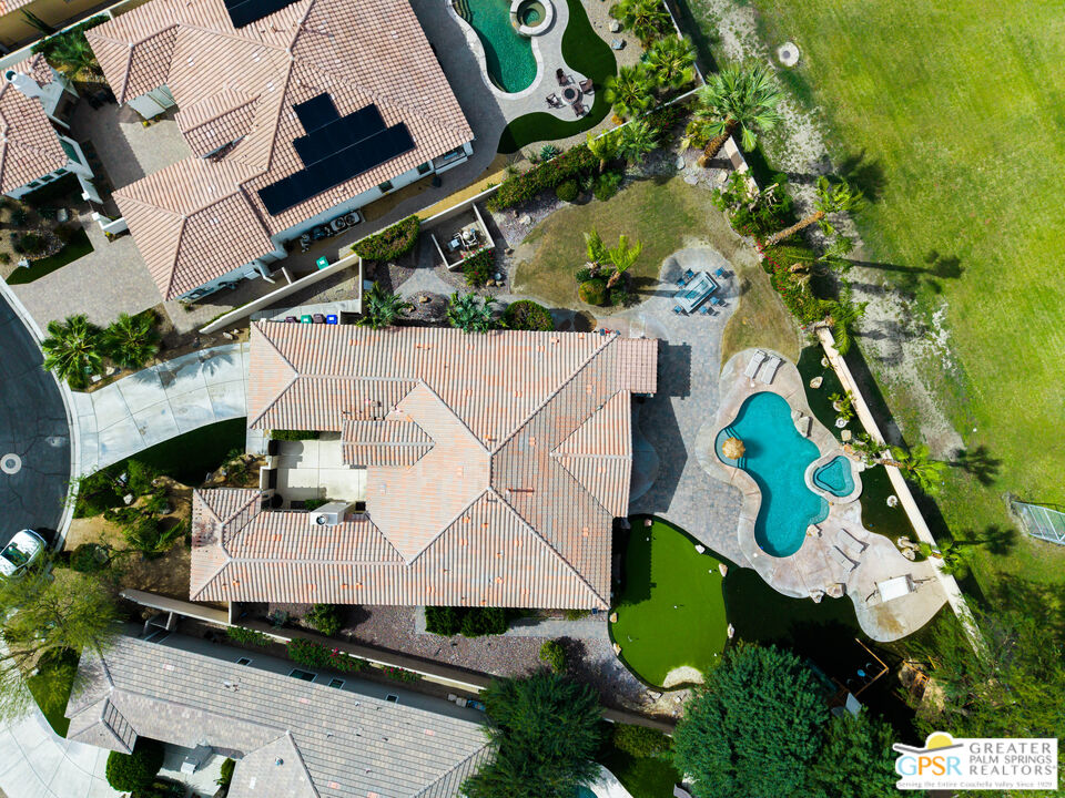 74226 Via Venezia Palm Desert, CA 92260 - Photo 37 of 38 an aerial view of a house with a yard and trees
