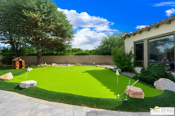 a view of a golf course with a garden