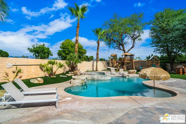 a view of a swimming pool with a patio