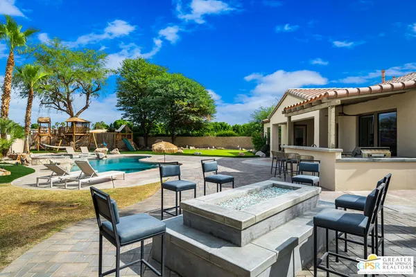 a view of an chairs and tables in the patio