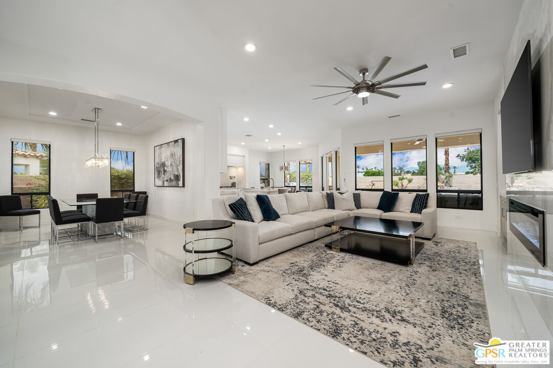 74226 Via Venezia Palm Desert, CA 92260 - Photo 9 of 38 a living room with furniture and a flat screen tv
