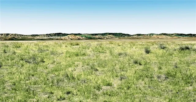 a view of a lake with houses in the back