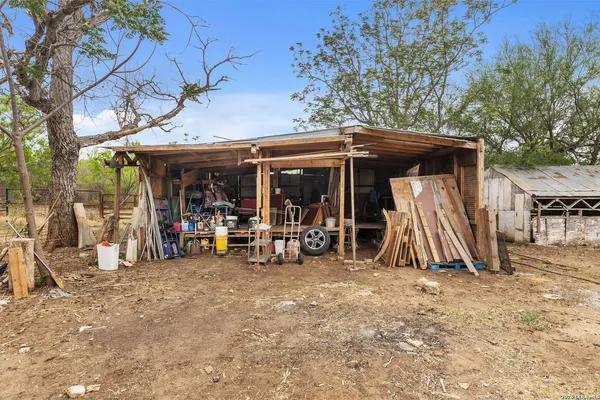 a view of a storage room with a table and chairs
