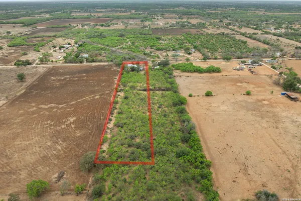 a view of a yard with an ocean