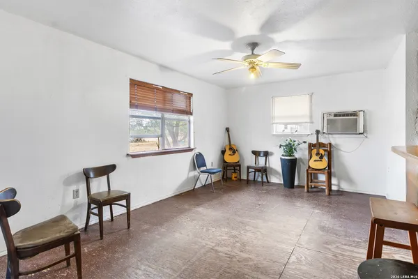 a living room with furniture and a window